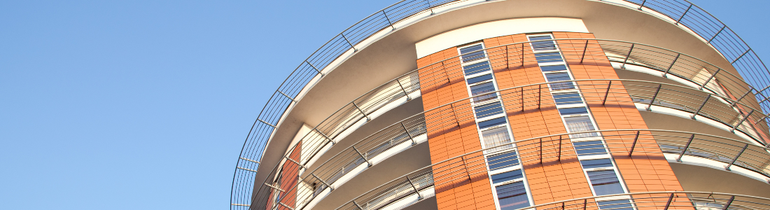 Looking up at modern apartment block