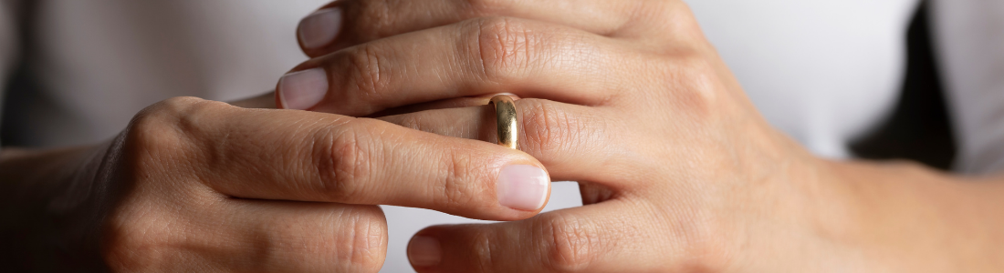 Person removing their wedding ring