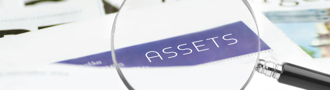 Looking through a magnifying glass at the word Assets