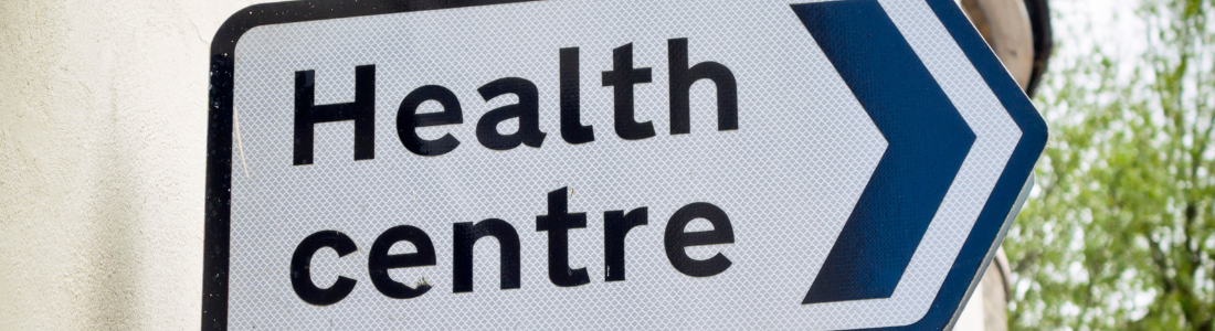 Direction sign to health centre