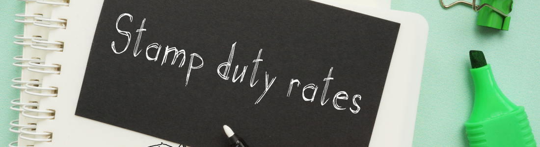 Words stamp duty rates written in notebook