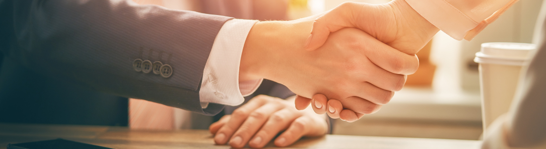 Handshake over desk