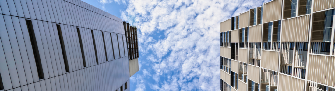 Looking up at two tower blocks