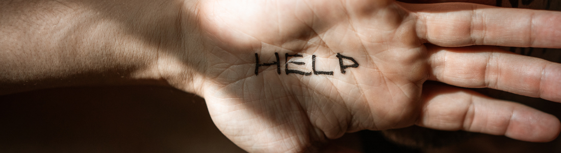 Abuse victim writes HELP on their hand