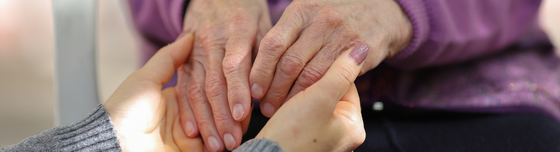 Holding elderly hands