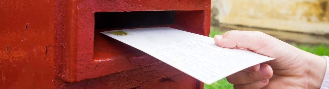 Letter being posted in postbox