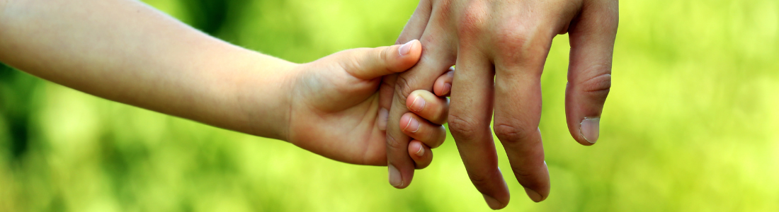 Parent and child holding hands